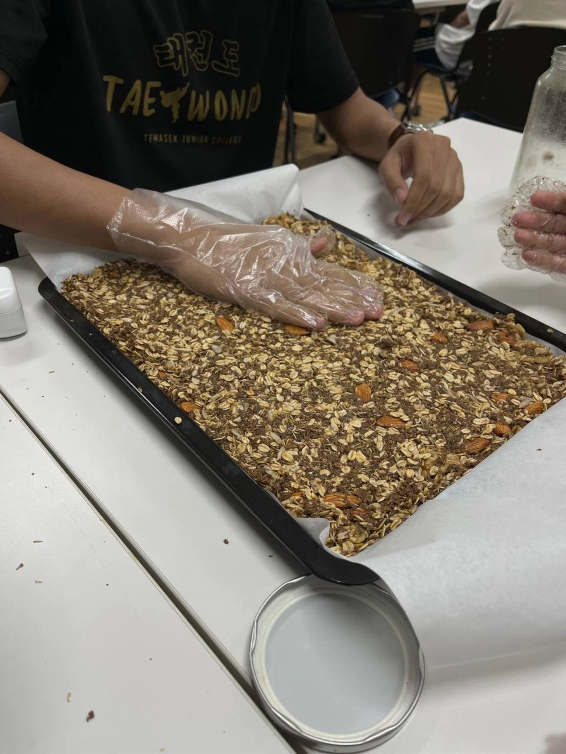 Helixians preparing the granola for baking