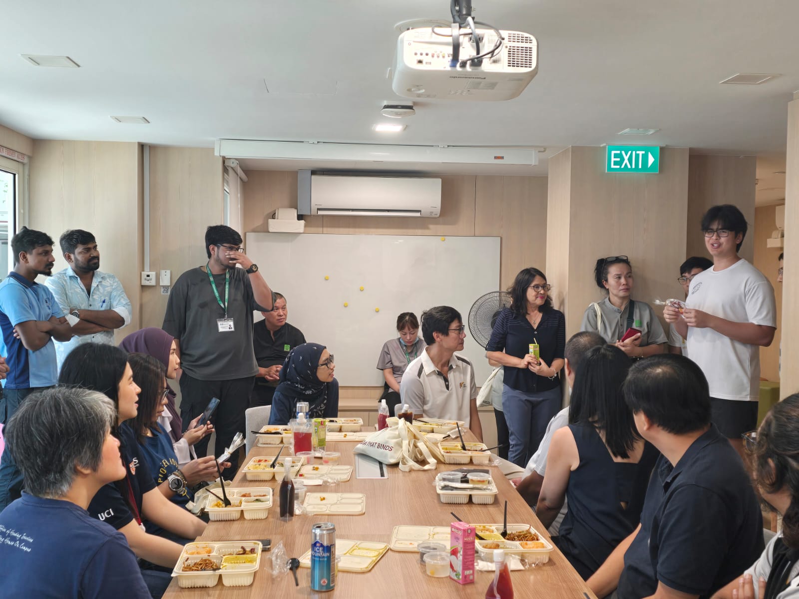 Helixian from the HeArt Interest Group explaining the hand-crafted gift they prepared for everyone