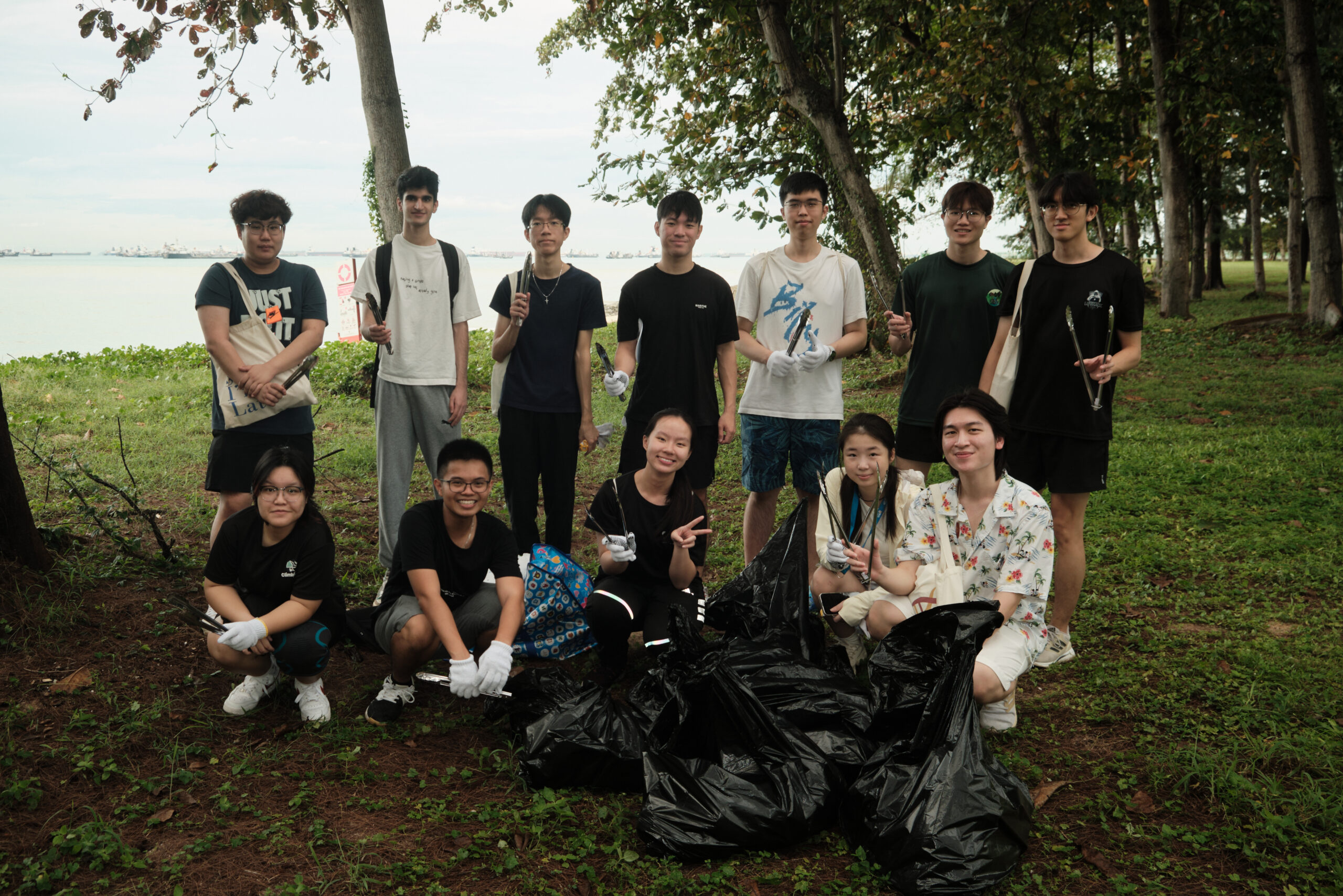 Helixians with bags of trash, tons of purpose. Together, turning the tide on pollution.