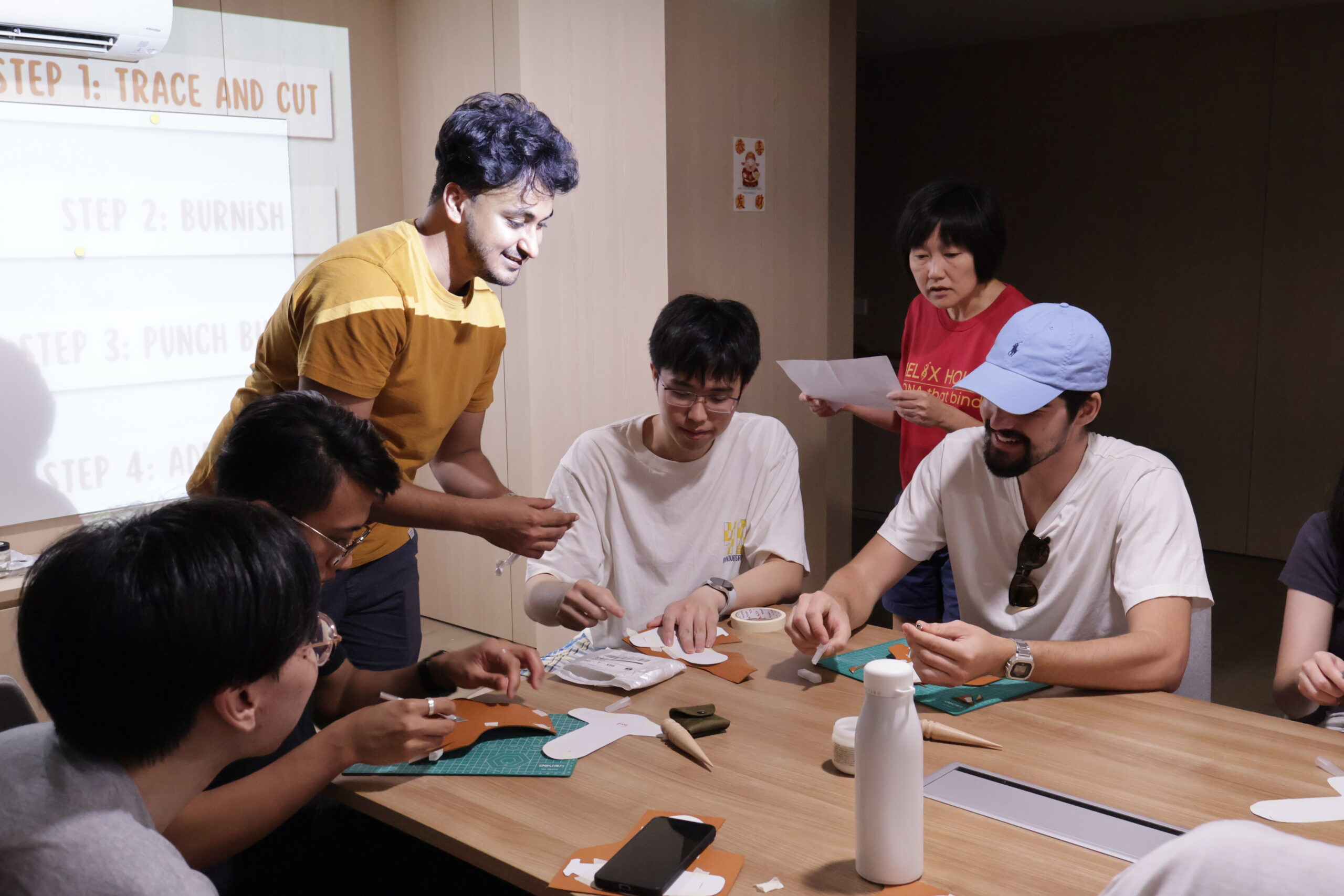 Helixians having some hands-on preparation for the leather crafting workshop