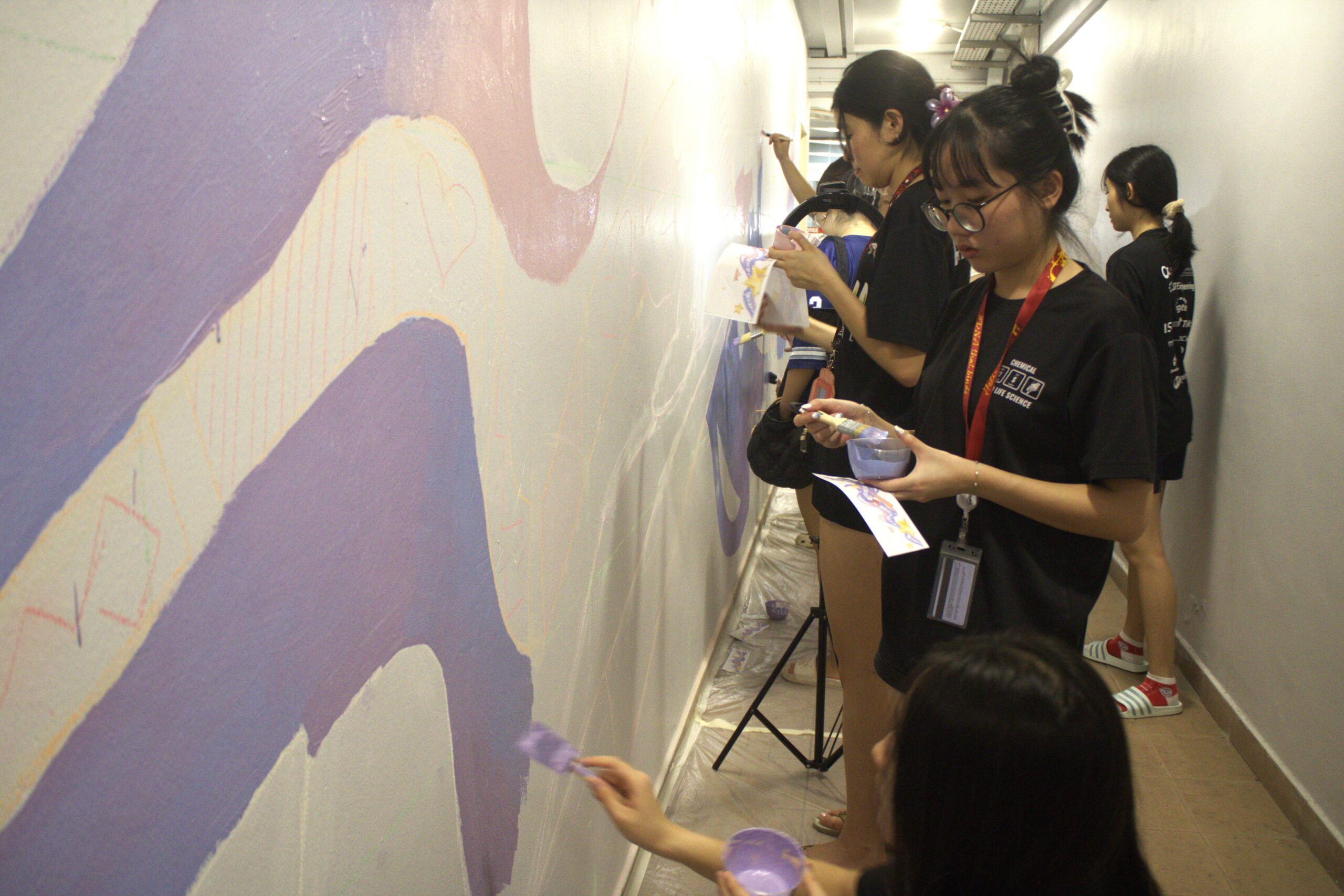 Helixians brushing creativity onto blank walls—turning spaces into stories!