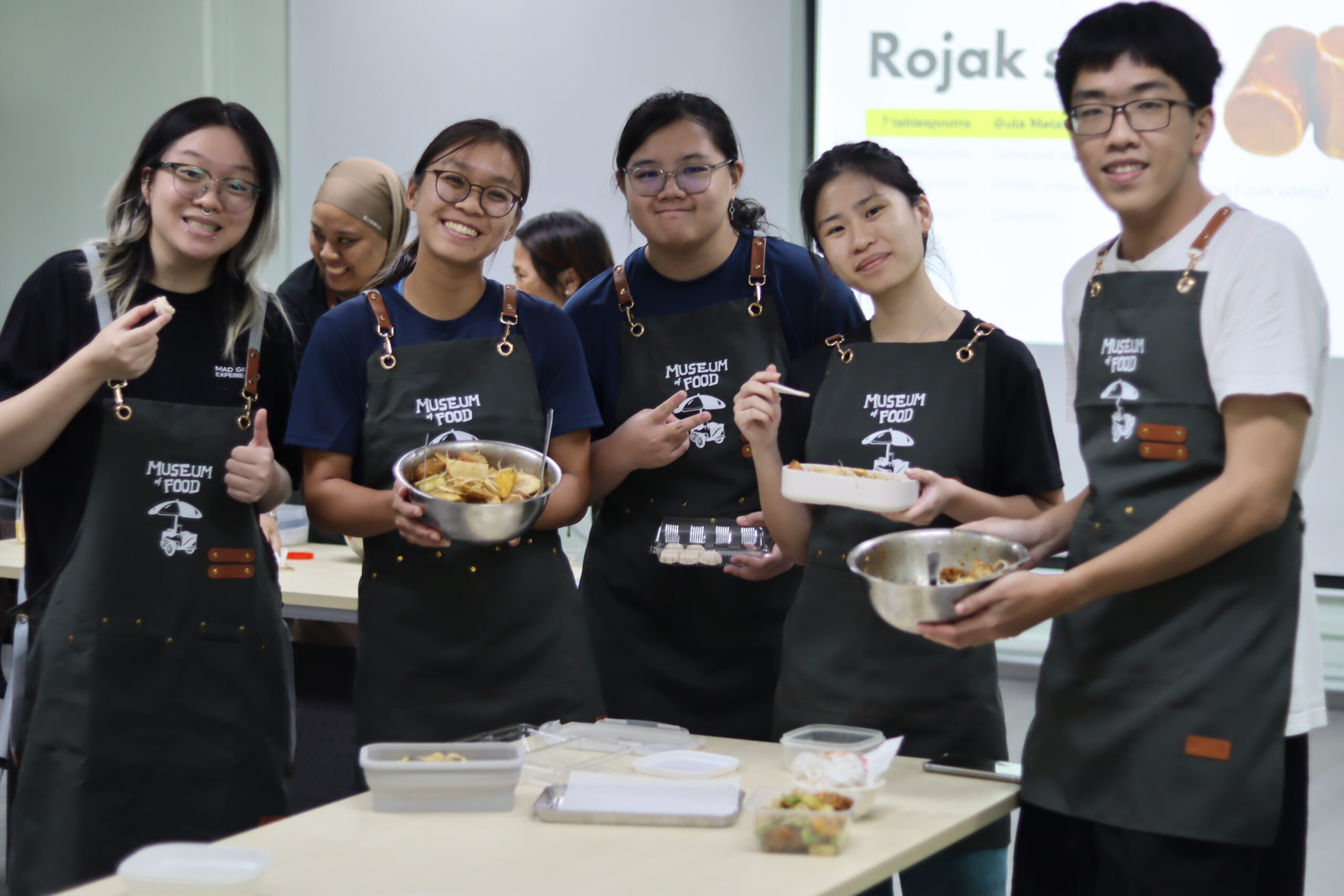 The workshop buzzed with teamwork as ingredients came together for homemade rojak.